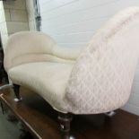 A cream double ended sofa,.