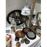 A cut glass decanter, copper plaques, bowbell and oval mirror etc.