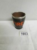 A miniature fire bucket with silver rim.