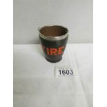 A miniature fire bucket with silver rim.