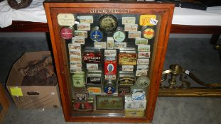 A cased display of vintage tins.