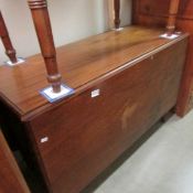 A mahogany drop leaf table.