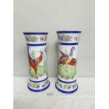 A pair of bird decorated vases.