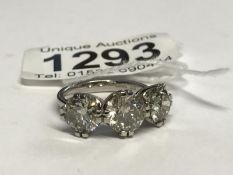A platinum 3 stone diamond ring, 5.55ct in total, size O.