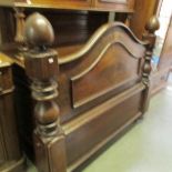 A Victorian mahogany foot board for a half tester bed.