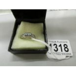 A 14ct 2 bar diamond and emerald ring, size L.