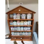 A Lenox fire porcelain spice village in pine rack