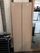 A thin double doored wardrobe