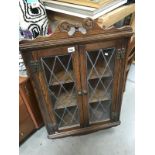 A flazed corner wall cabinet