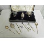 A cased 3 piece silver plate cruet set and 7 items of silver.