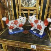 A pair of Staffordshire cats.