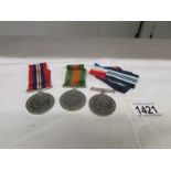 3 George VI WW2 medals and a quantity of ribbons.