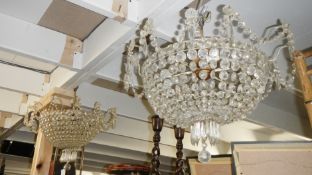 A pair of crystal chandeliers.