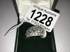 A white gold 9.8 gram emerald and diamond ring, size T.