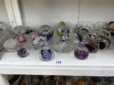 A good collection of 15 glass/crystal paperweights includig mushrooms & handbags etc.