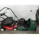A Suffolk Punch petrol mower & a lawn raker attachment