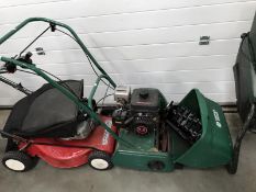 A Suffolk Punch petrol mower & a lawn raker attachment