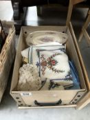 A box of old embroidery, vintage linen etc.