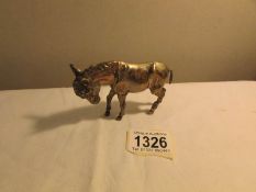 A hall marked silver donkey.