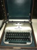 A Vintage Remington travelwriier cased typewriter