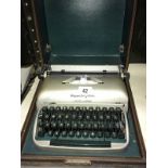 A Vintage Remington travelwriier cased typewriter