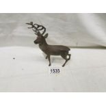 A cast metal figure of a stag.