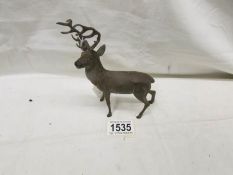 A cast metal figure of a stag.