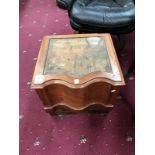 A carved wood commode box