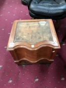 A carved wood commode box