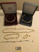 2 silver bangles, a silver bracelet and matching silver necklace, bracelet and earrings.