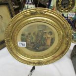 A gilt framed and glazed oval Victorian print entitled 'Out of School'.