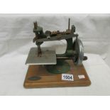 A vintage child's sewing machine by Grain.