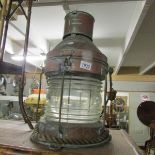 A large old copper ships lamp.