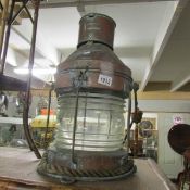 A large old copper ships lamp.