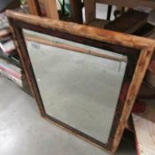 A bamboo framed bevel edged mirror.