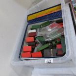 A box of miscellaneous '00' gauge accessories and track.