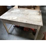 A white painted tongue & groove kitchen table