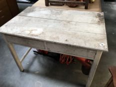 A white painted tongue & groove kitchen table