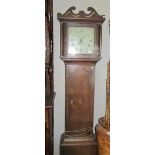 A 30 hour oak cased Grandfather clock complete with weight and pendulum.