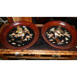 A pair of wall plaques with applied mother of pearl birds.
