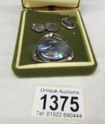 A matching set of abalone shell pendant earrings as hearts,