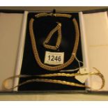 A 9ct gold necklace and bracelet marked 375 Italy (approximately 40 grams) and an a/f tricolour