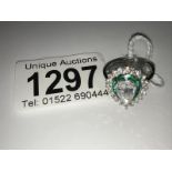 An 18ct white gold fine quality art deco style emerald and diamond ring.