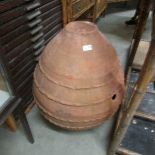 An antique large terracotta olive pot