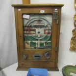 A vintage fair ground slot machine,.