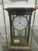 A brass cased clock.