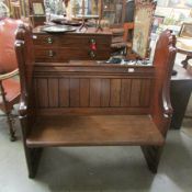 An antique pitch pine pew