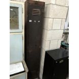 A tall metal locker with key