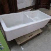 A Twyfords double Belfast sink with pedestals.