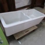 A Twyfords double Belfast sink with pedestals.